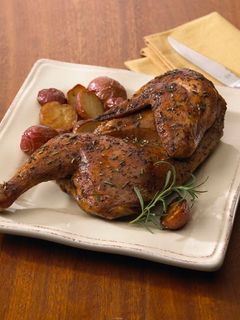 A picture of Roasted Half Chicken with Chickpea and Gigande Hoppin' John.