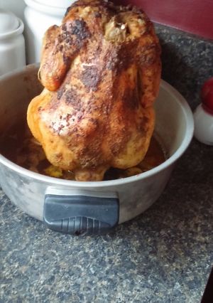 A picture of Beer Can Chicken in oven.