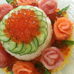 A picture of Flower-Themed Sushi Cake for Mother's Day and Special Occasions.