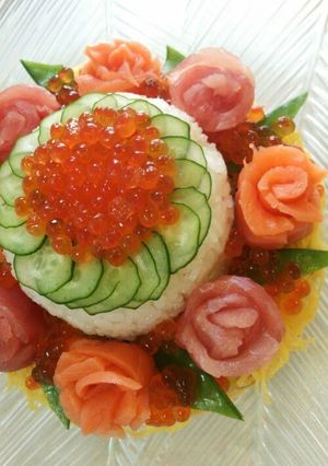 A picture of Flower-Themed Sushi Cake for Mother's Day and Special Occasions.