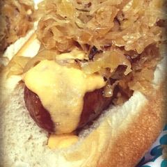 A picture of Tailgater Beer Brats with Zippy Cheese Sauce.