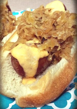 A picture of Tailgater Beer Brats with Zippy Cheese Sauce.