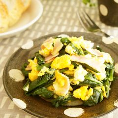 A picture of Sautéed Spinach with Bacon and Eggs.