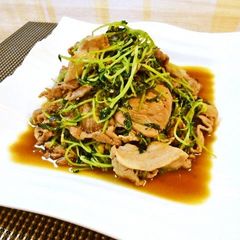A picture of Pork Bits and Pea Shoots Stir-Fried with Ginger and Pepper.