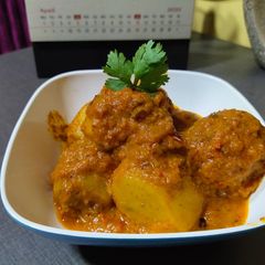 Stuffed potatoes in red gravy A picture of Stuffed potatoes in red gravy.