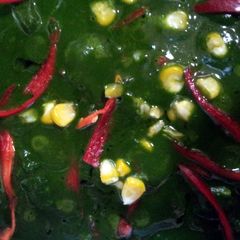 A picture of Spinach with cottage cheese and sweet corn.