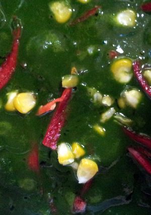 A picture of Spinach with cottage cheese and sweet corn.