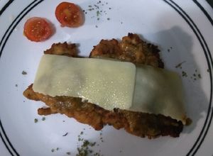 Una foto de Milanesa de pollo a la napolitana