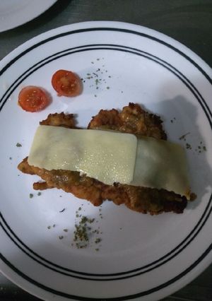 Una foto de Milanesa de pollo a la napolitana