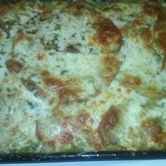 A picture of Chicken and cheese enchiladas.