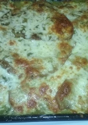 A picture of Chicken and cheese enchiladas.
