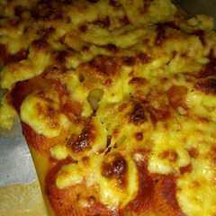 Una foto de Canelones al horno rellenos de queso