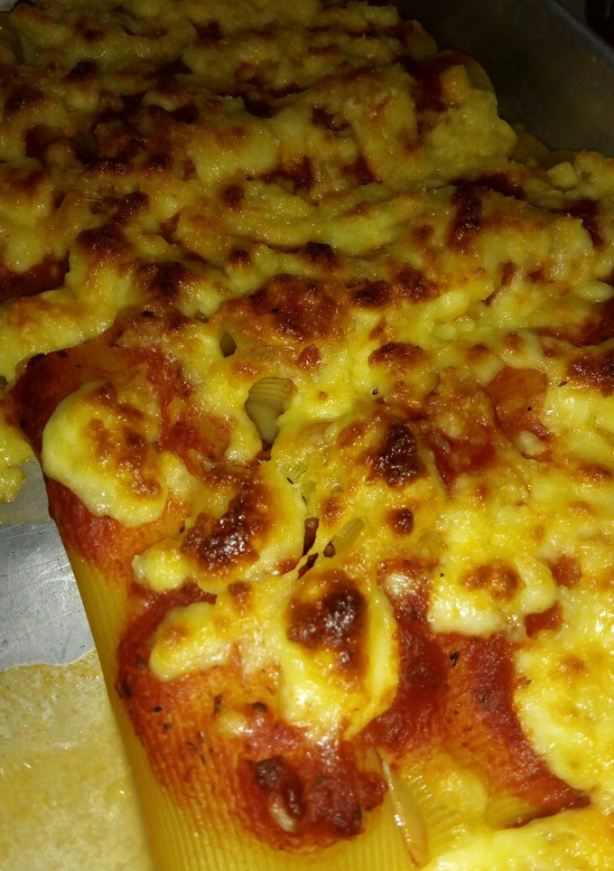 Una foto de Canelones al horno rellenos de queso
