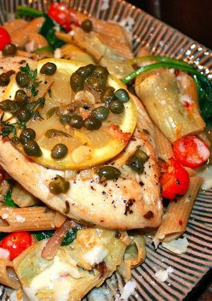 A picture of Chicken picatta w/artichoke hearts.
