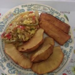 A picture of Ackee &saltfish with breadfruit and plantain.