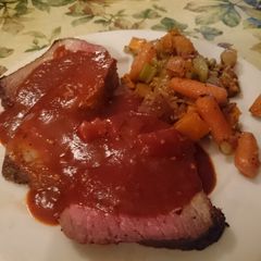 A picture of Slow-Cooked Roast Beef with Red Sauce.