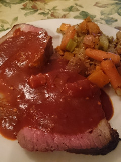 A picture of Slow-Cooked Roast Beef with Red Sauce.