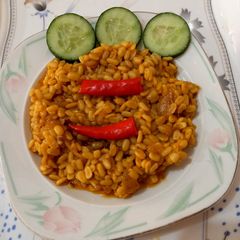 A picture of Fried dal mash 🌾🌾🌶️🌶️🥒.