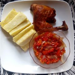 A picture of Yam fries and tomatoes sauce paired with chicken.
