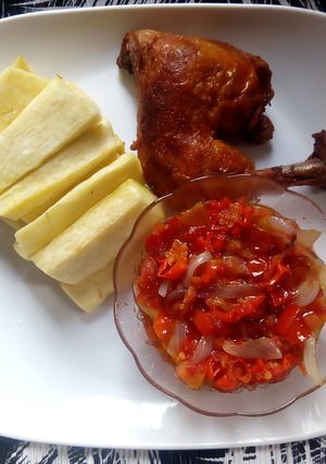 A picture of Yam fries and tomatoes sauce paired with chicken.