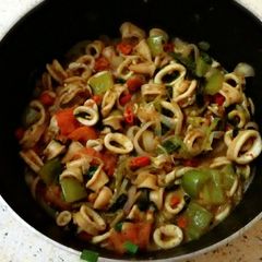 A picture of Calamari rings in mushroom&veggies.