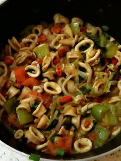 A picture of Calamari rings in mushroom&veggies.