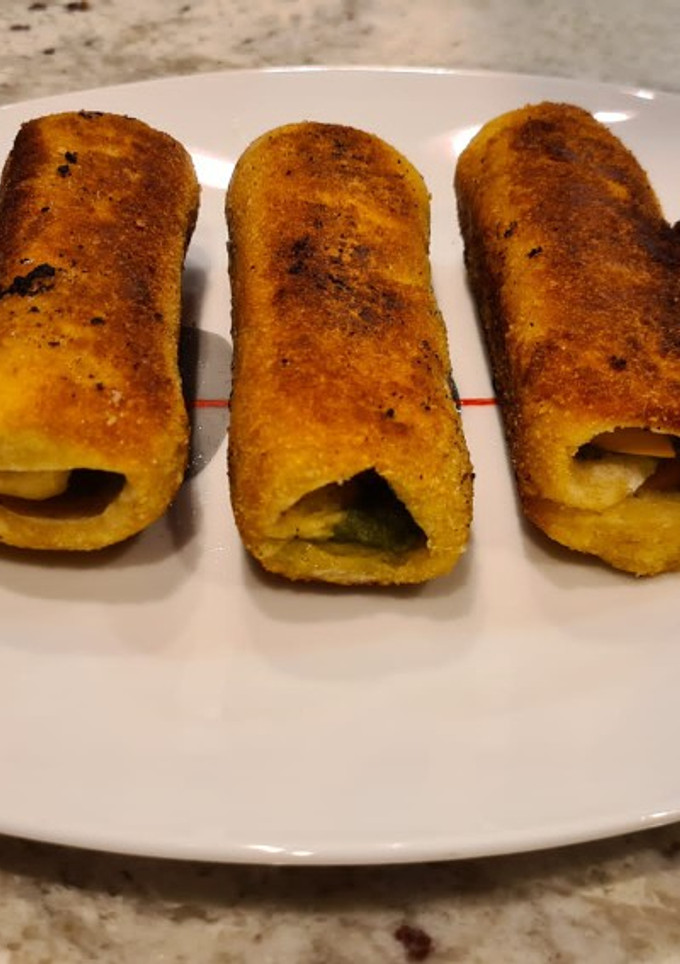 Una foto de Canutillos de pan de molde rebozados