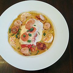 Roasted Red Peppers Stuffed with pasta in a Garlic Broth A picture of Roasted Red Peppers Stuffed with pasta in a Garlic Broth.