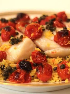 A picture of Extra Virgin Olive Oil Poached Cod with Roasted Tomatoes and Fried Capers.