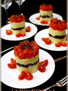 A picture of Cylindrical Salad with Mashed Potatoes and Salmon.