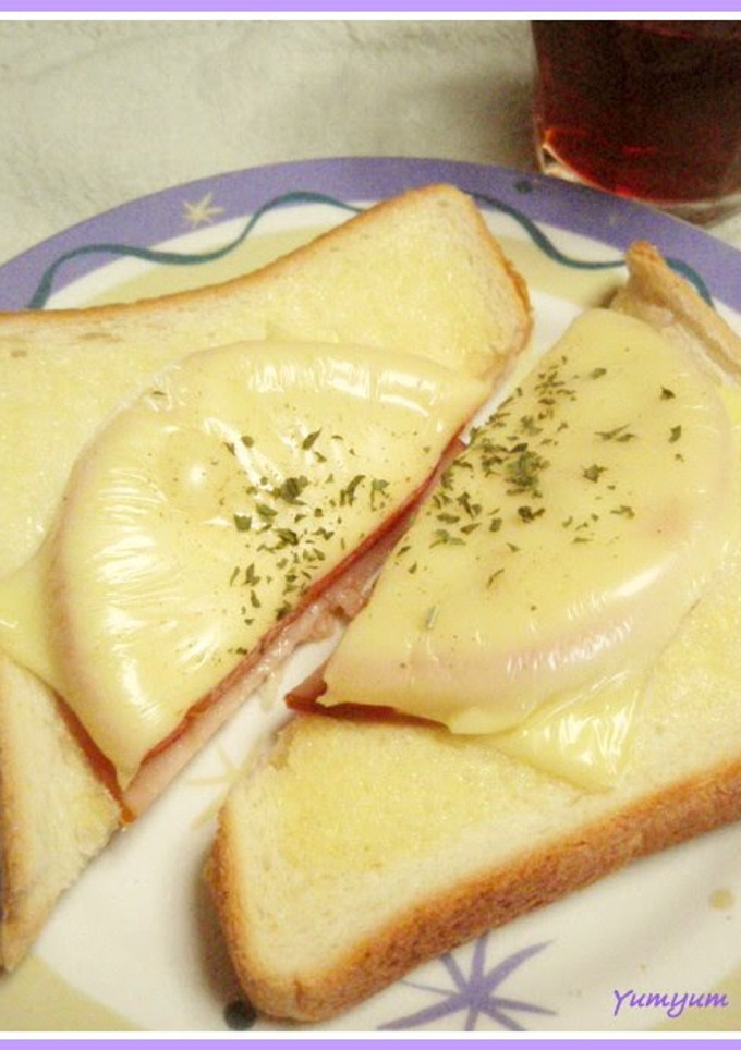 A picture of Toast with Ham, Tomatoes, and Cheese.