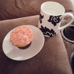 A picture of White cake mix cup cakes with strawberry frosting..