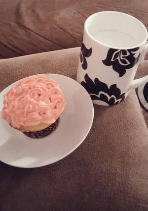 A picture of White cake mix cup cakes with strawberry frosting..