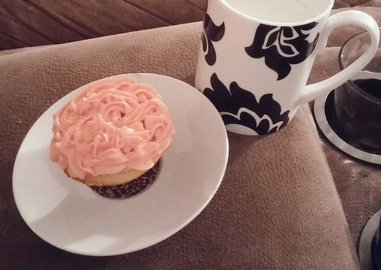 White cake mix cup cakes with strawberry frosting.