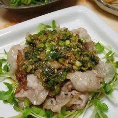 A picture of Pork Belly with Sweet and Sour Onion Sesame Sauce.