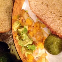 A picture of Talipia With Orange, Avocado, Onions, Yellow Peppers And Jalepenos.