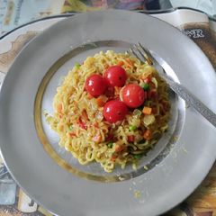 A picture of Maggi with veggies.