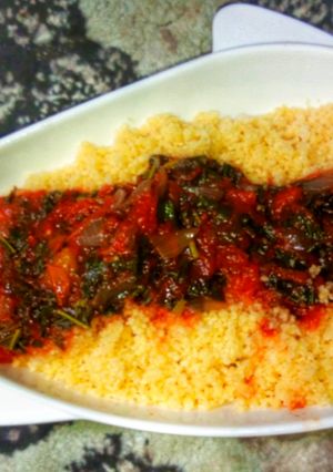 A picture of Steamed cous-Cous with spinach stew.