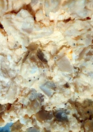 A picture of potatoe and egg salad.