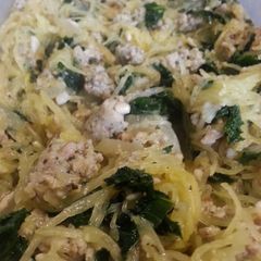 A picture of Spaghetti squash with kale and sausage.