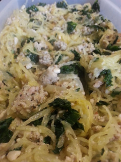 A picture of Spaghetti squash with kale and sausage.