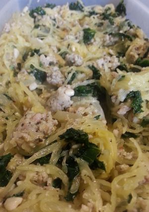 A picture of Spaghetti squash with kale and sausage.