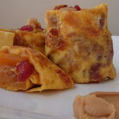 A picture of Fruits And Nuts With Peanut Butter Omelette Roll.