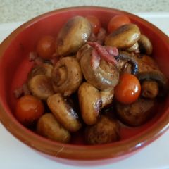 A picture of My Butter Fried Pansetta Garlic mushrooms and cherry Tomatoes.