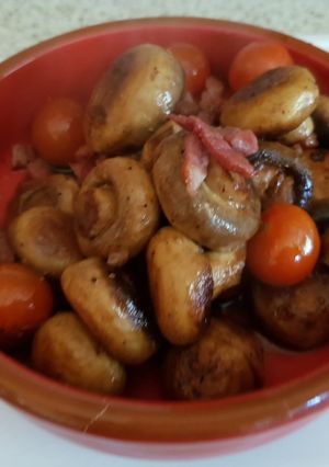 A picture of My Butter Fried Pansetta Garlic mushrooms and cherry Tomatoes.