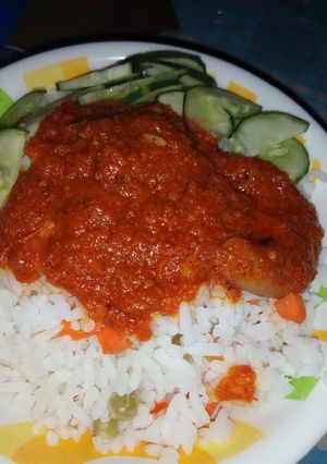A picture of White rice with carrot stew.