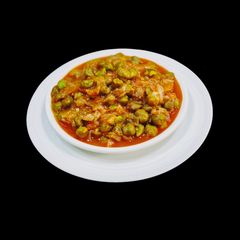 A picture of Green Chickpea In Onion Tomato Gravy.