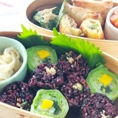 A picture of Black Rice Futomaki Rolls with Wasabi Stems.