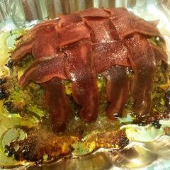 A picture of Beef Meatloaf wrapped in Turkey bacon.