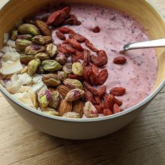 A picture of Fresh Strawberry and blueberry yoghurt breakfast smoothie bowl.